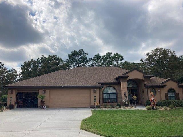 Brown House With Garage | Homosassa, FL | Washburn Roofing LLC
