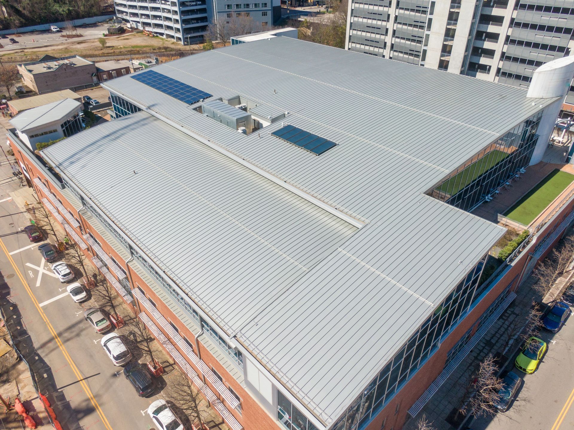 An Aerial View of a Large Building With a Metal Roof
