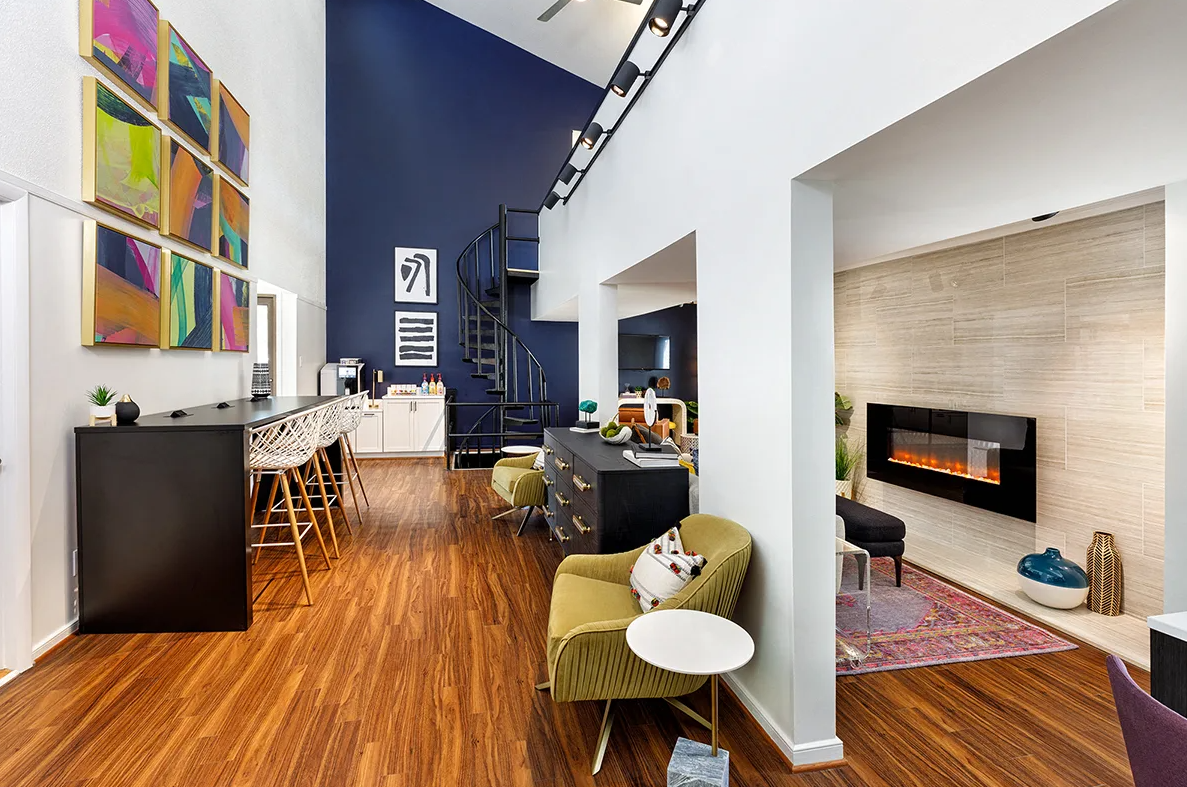 A living room with hardwood floors and a fireplace.