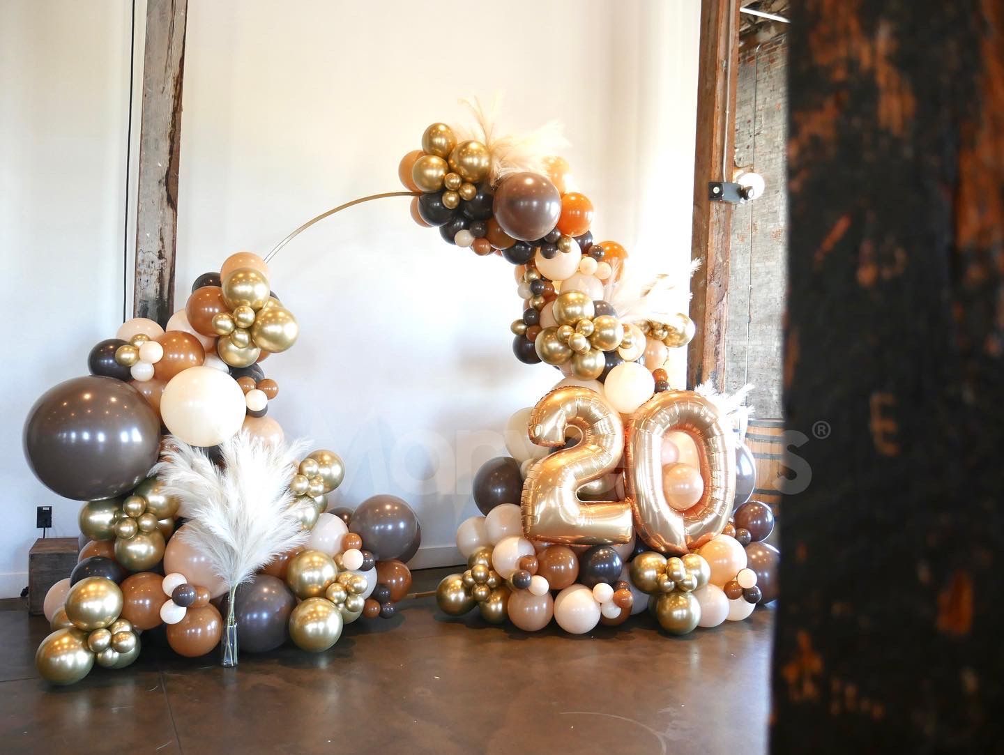 A bunch of balloons are sitting on the floor in a room.