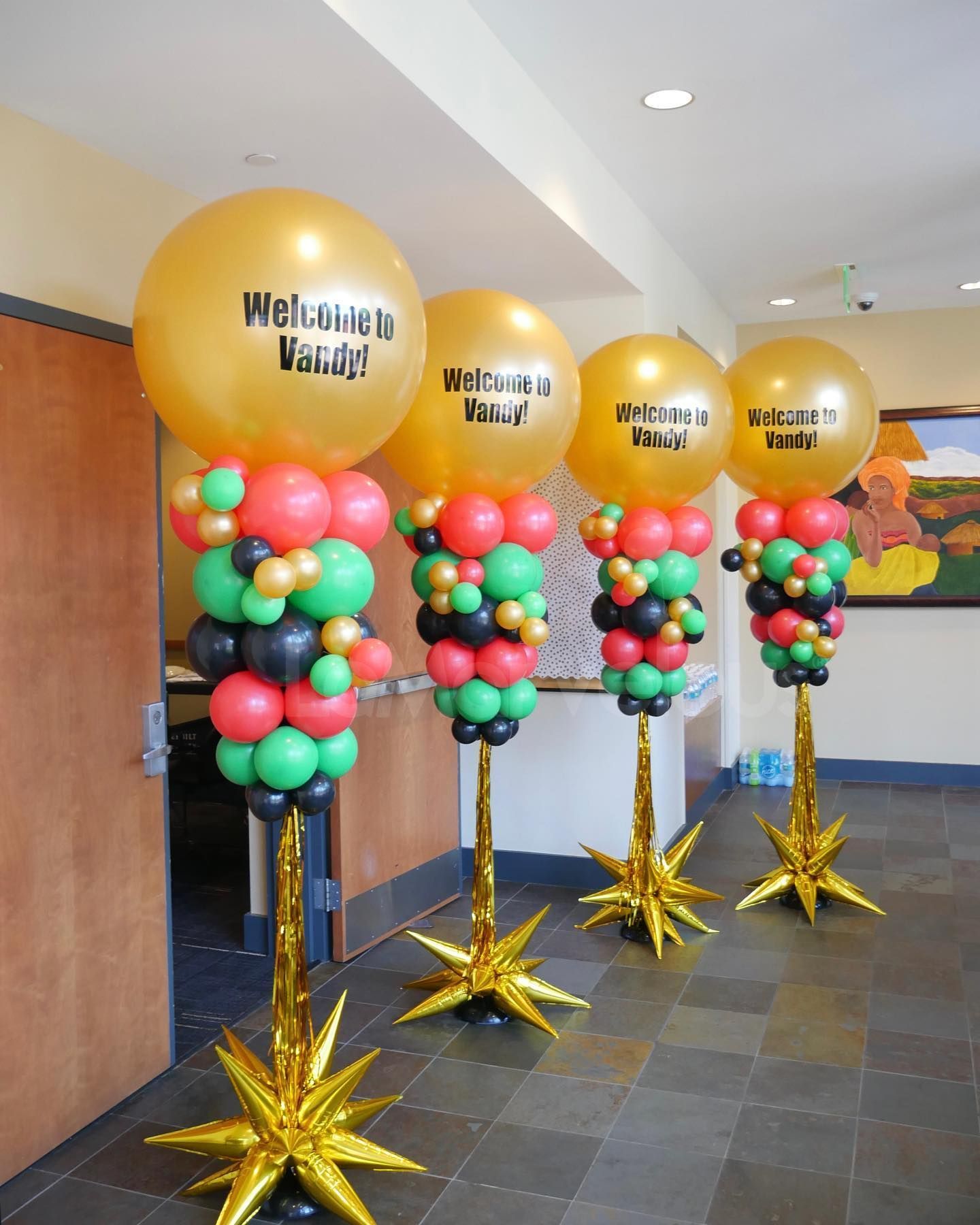 A row of balloons with one that says welcome value