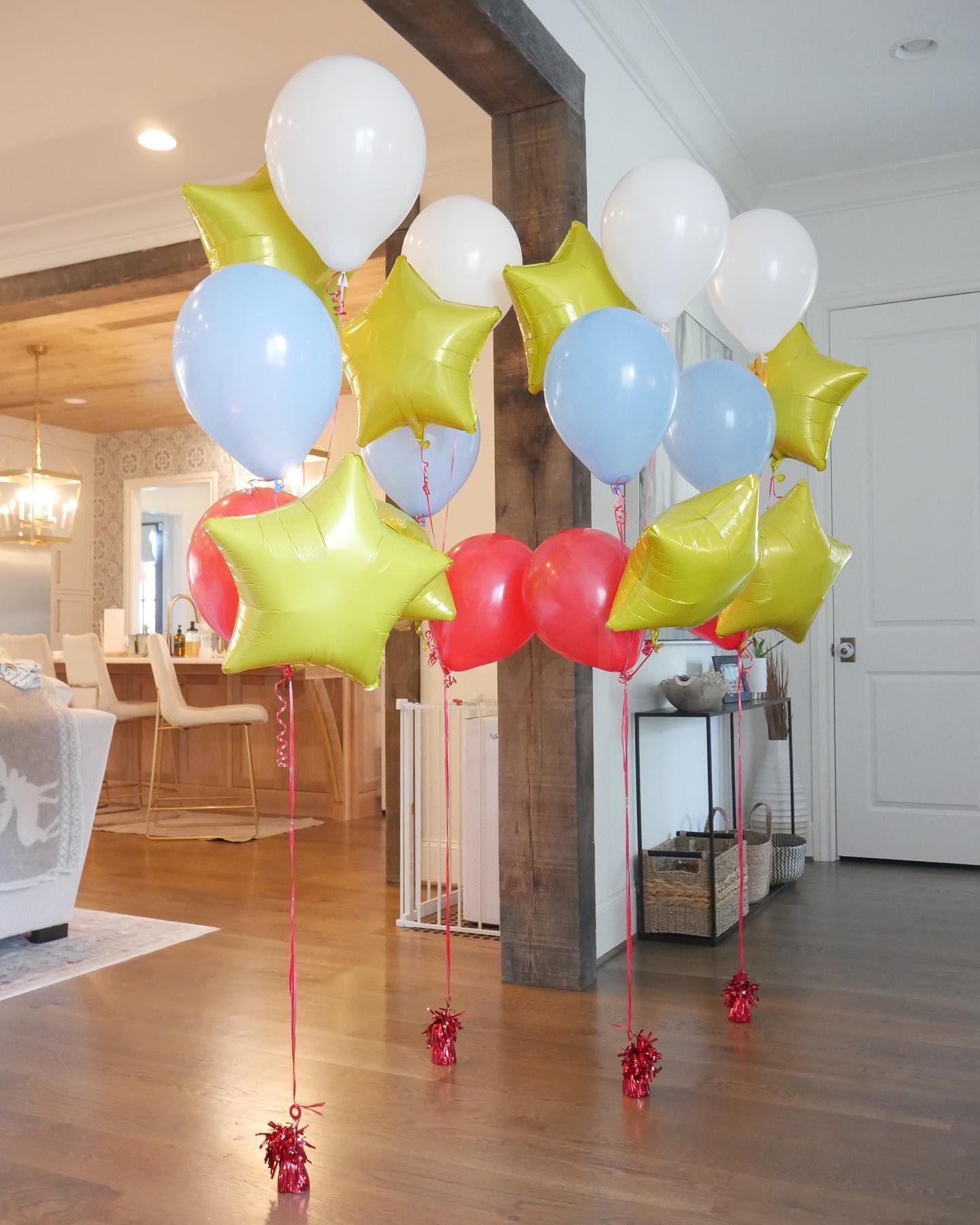 A bunch of balloons and stars in a living room