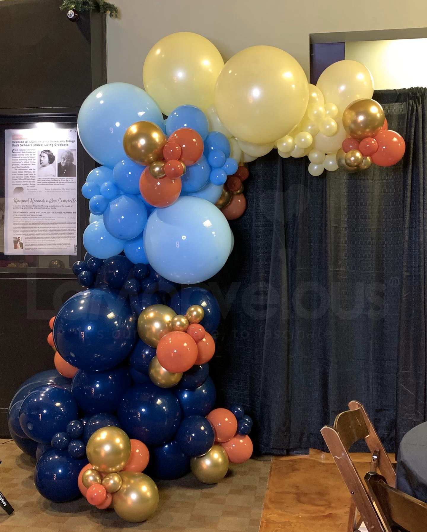 A bunch of balloons are sitting on the floor in a room