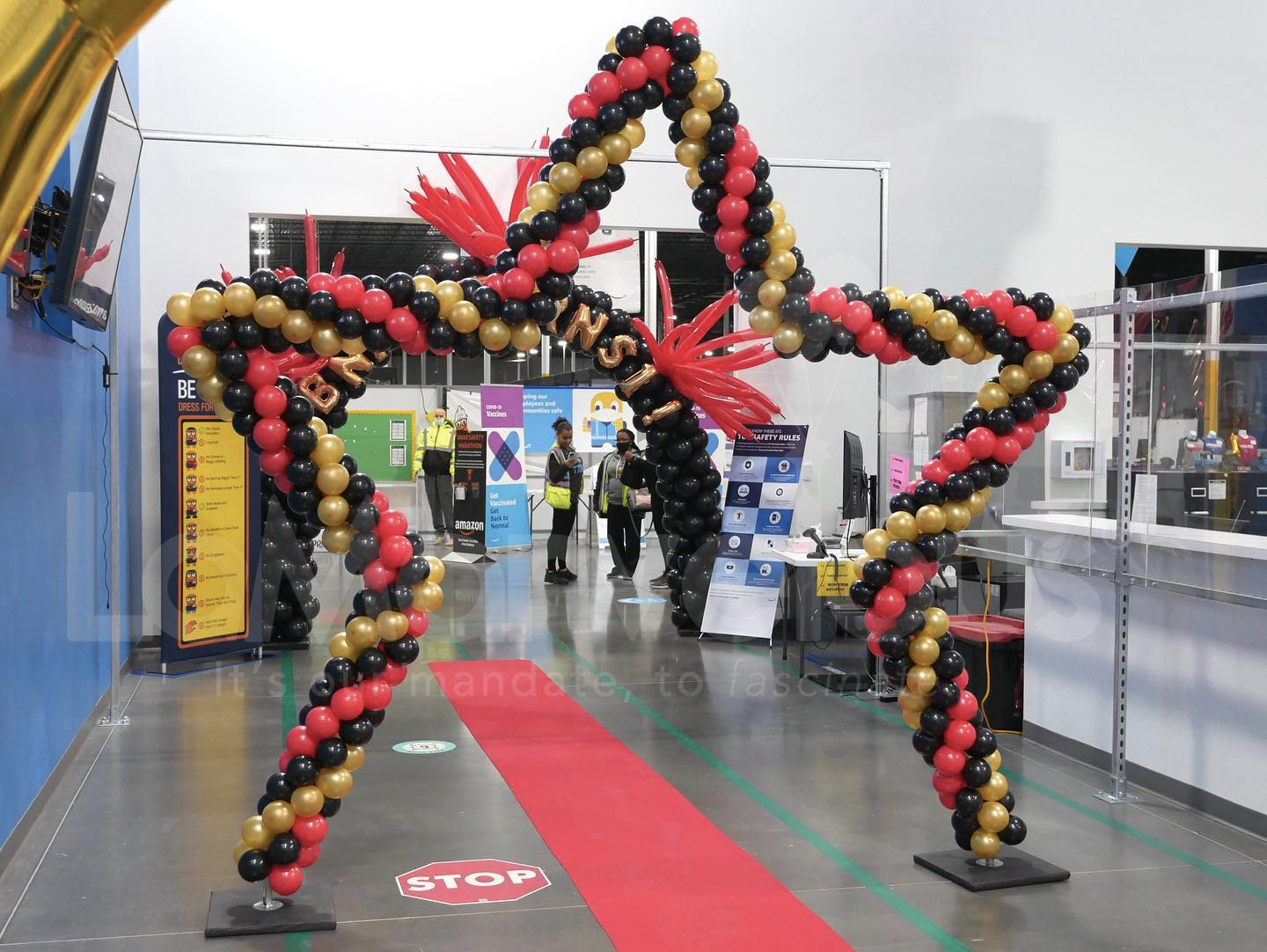 A large star made of balloons in a store