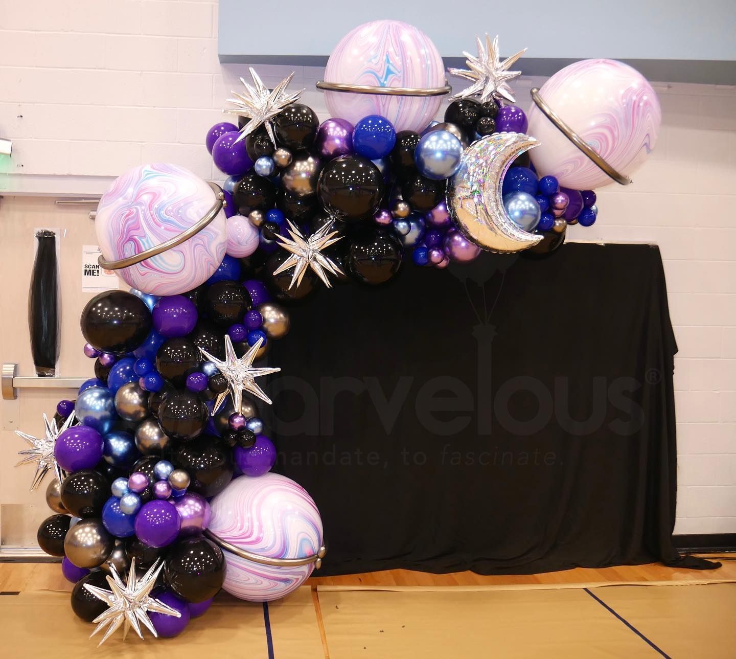 A bunch of balloons with the word marvelous on it