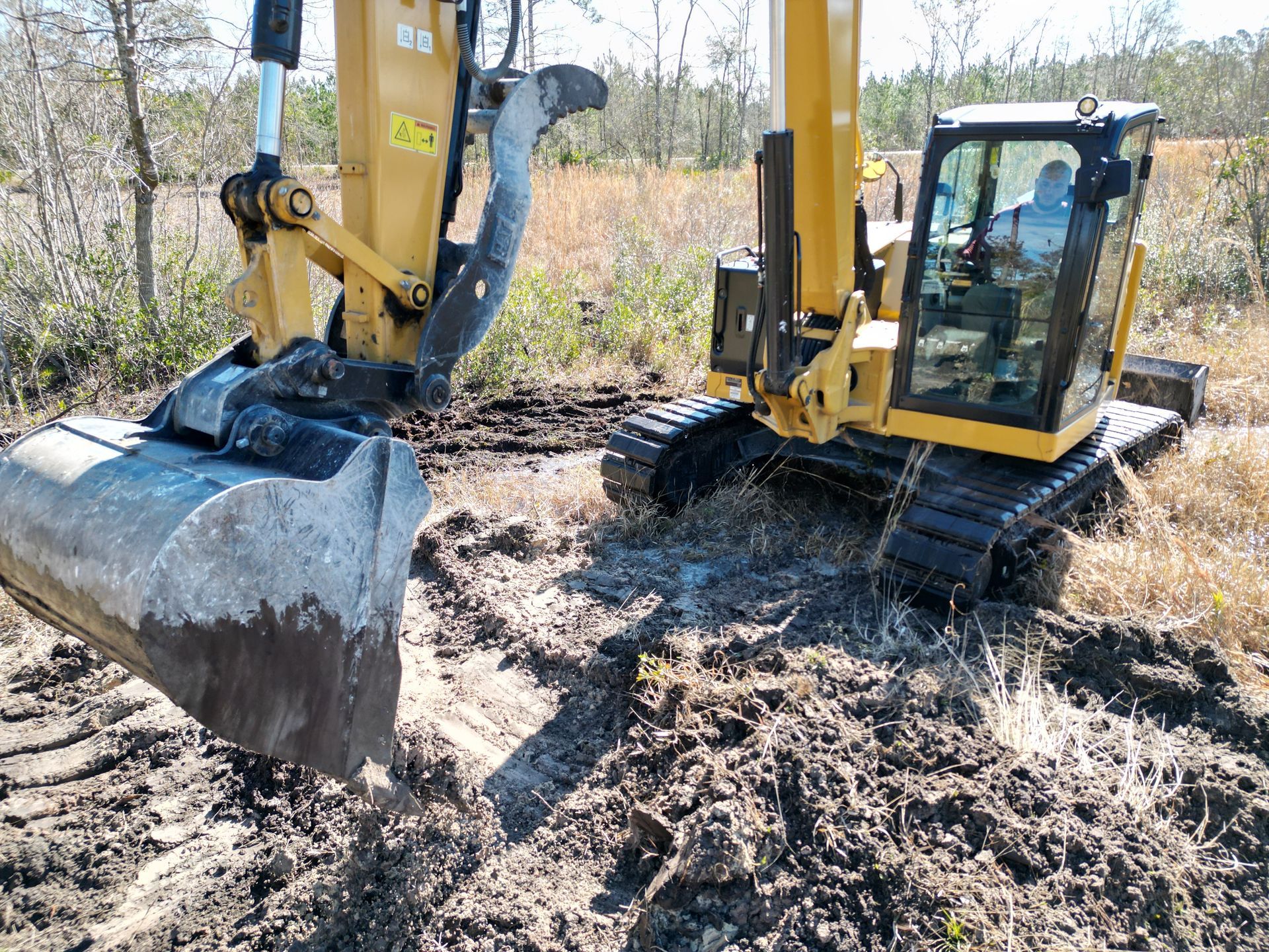 An aerial view of a parking lot with cars and trucks parked in it.
