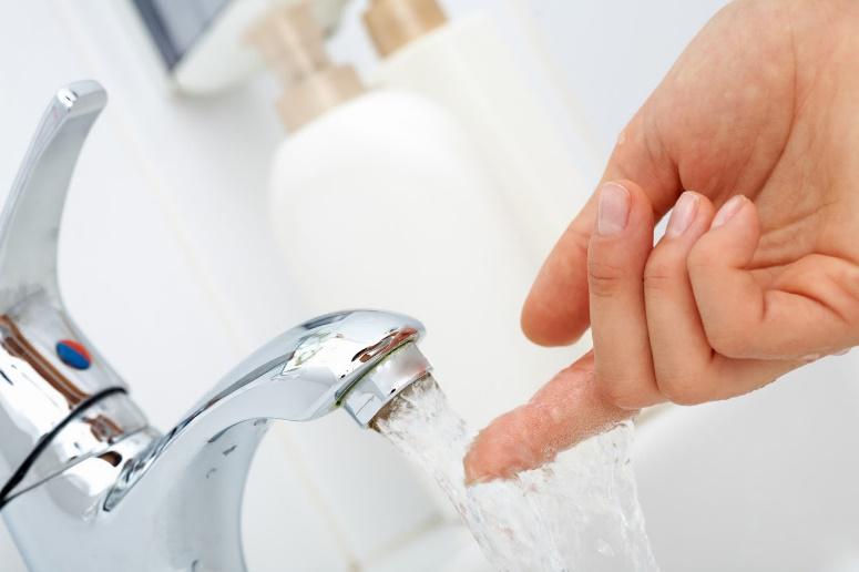 Finger on Running Faucet — Clearwater, FL — Scotto Services Plumbing