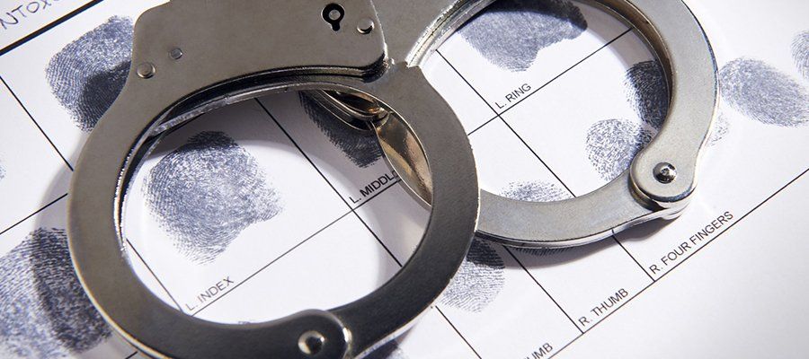 Bail Me Out — Handcuffs Above Fingerprints in Birmingham, AL