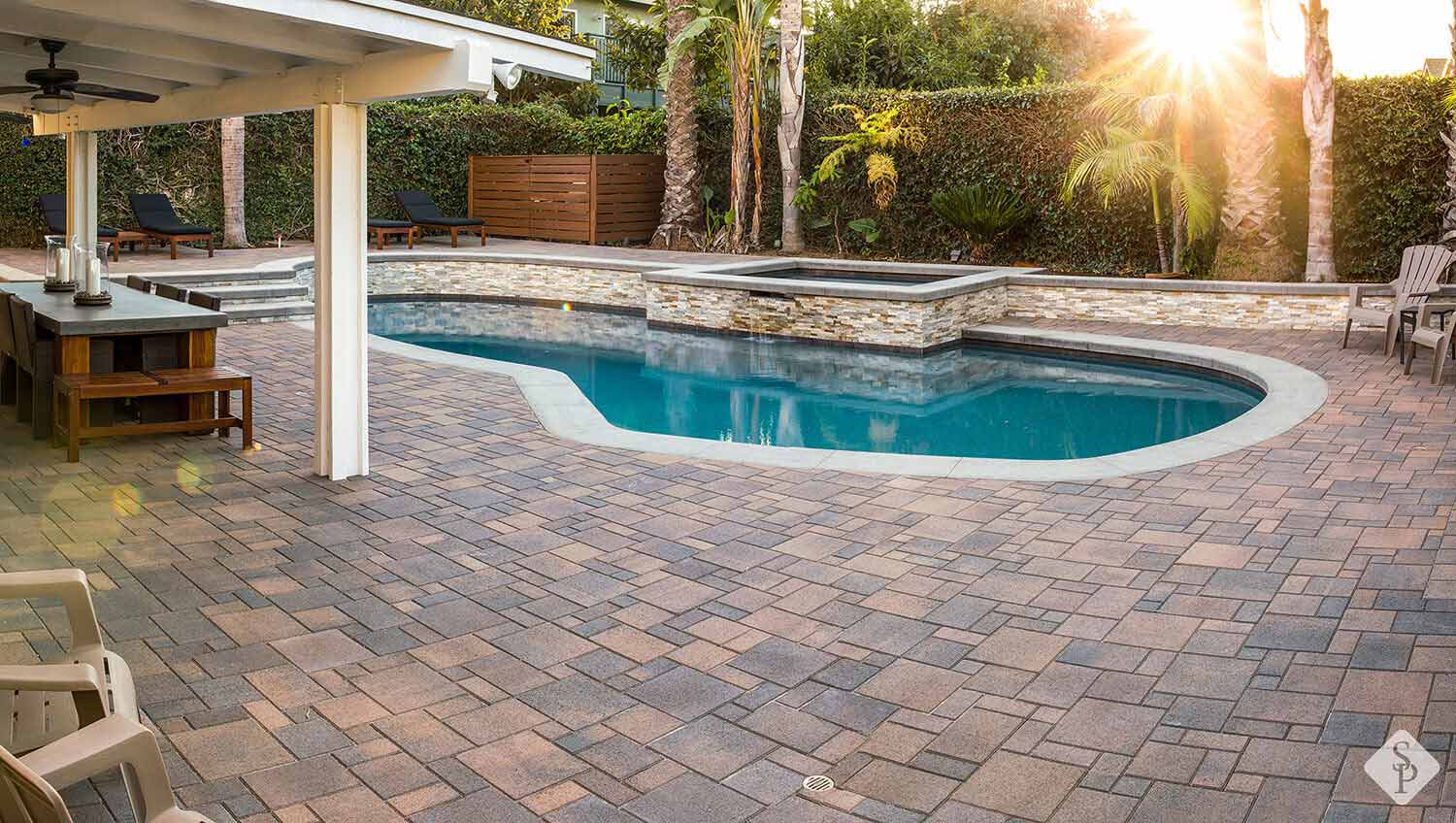 Pool renovation with pavers around pool
