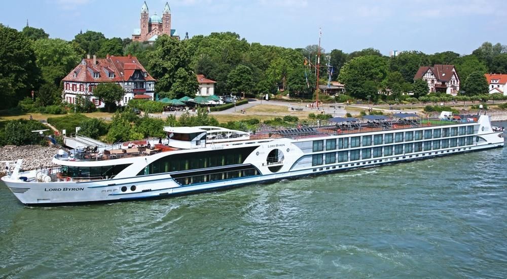 A large cruise ship is floating on top of a body of water.