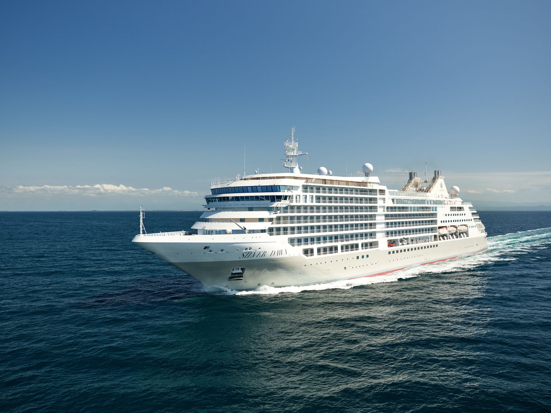 A large cruise ship is floating in the ocean