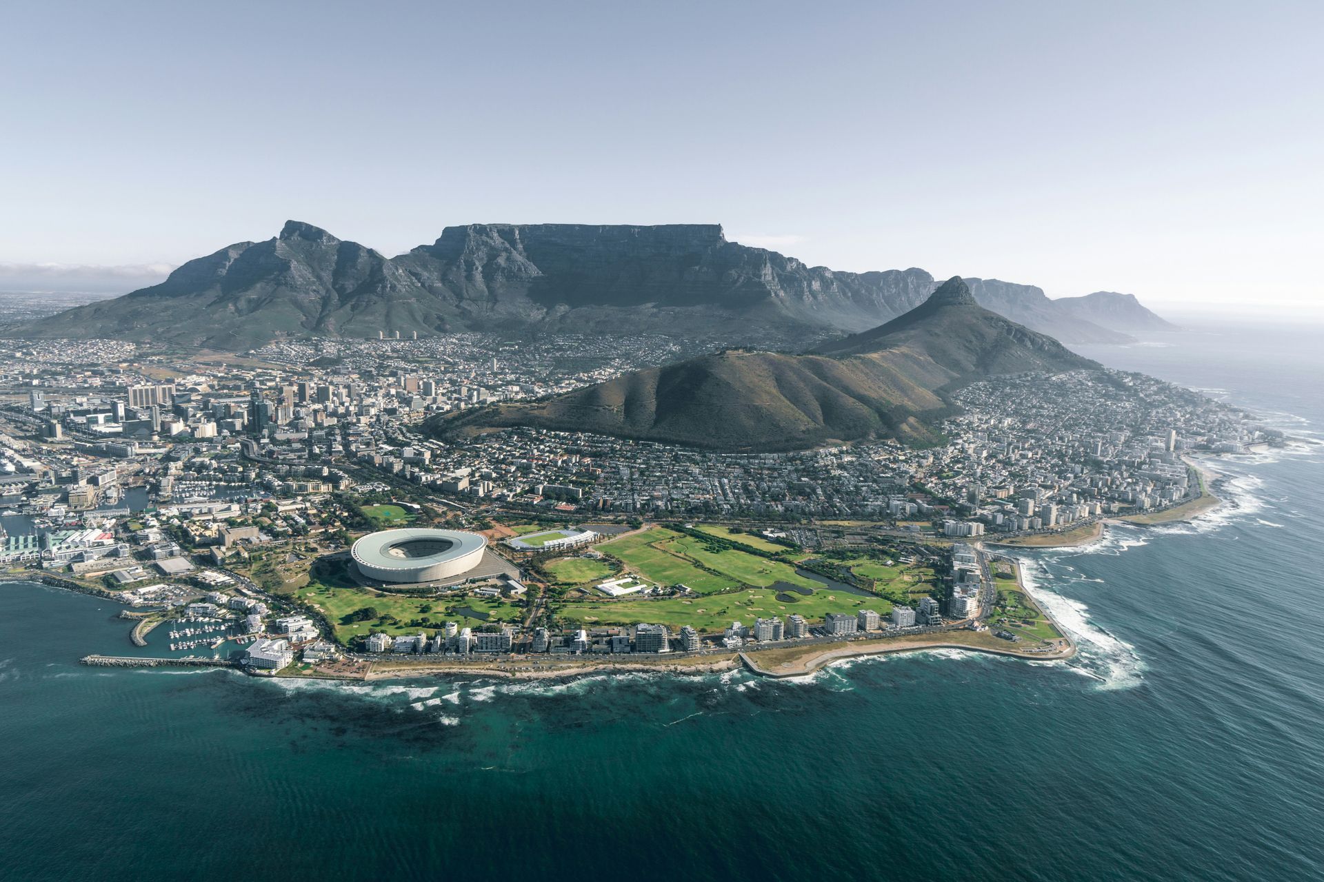 An aerial view of a city next to a body of water.