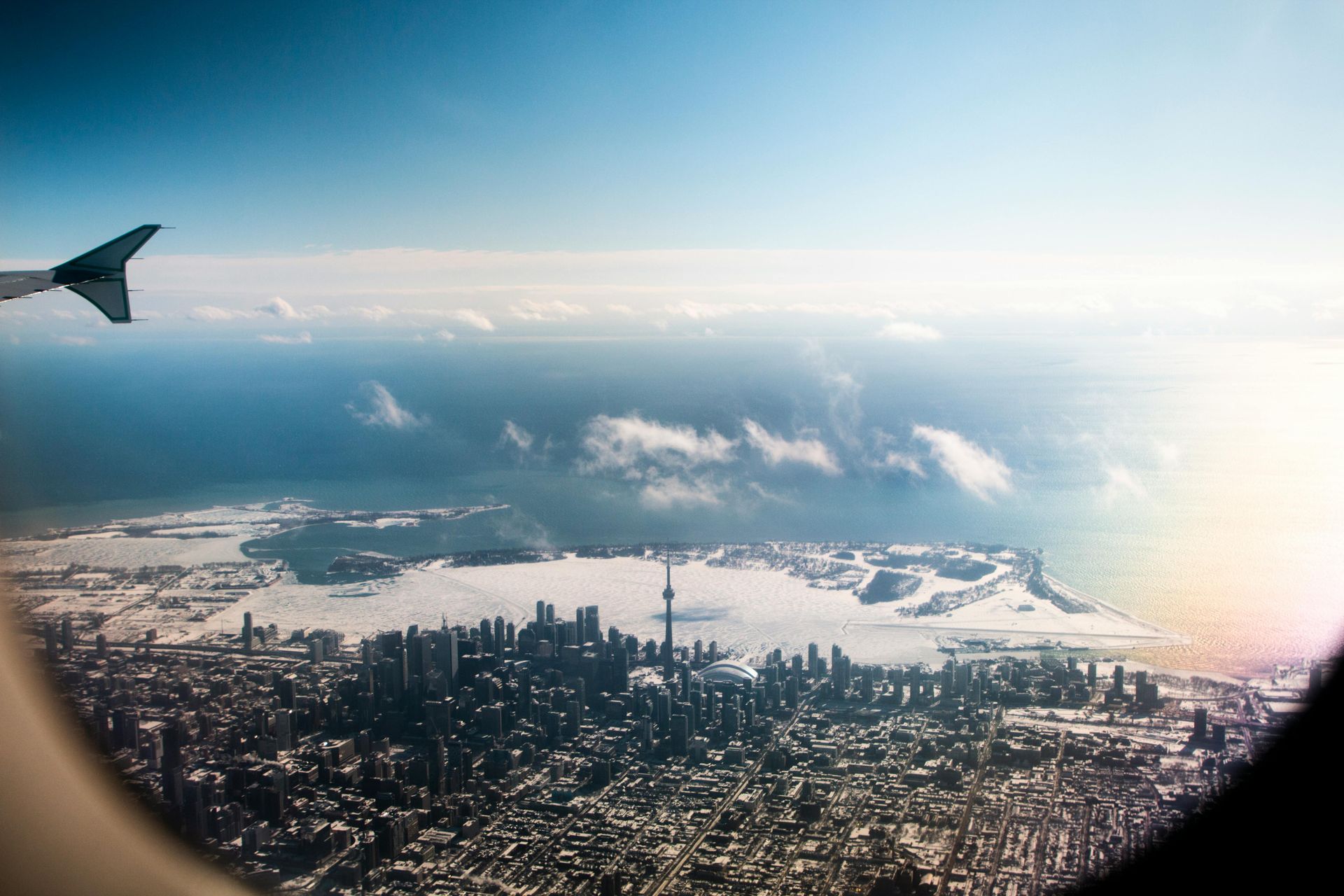 An aerial view of a city from an airplane window.