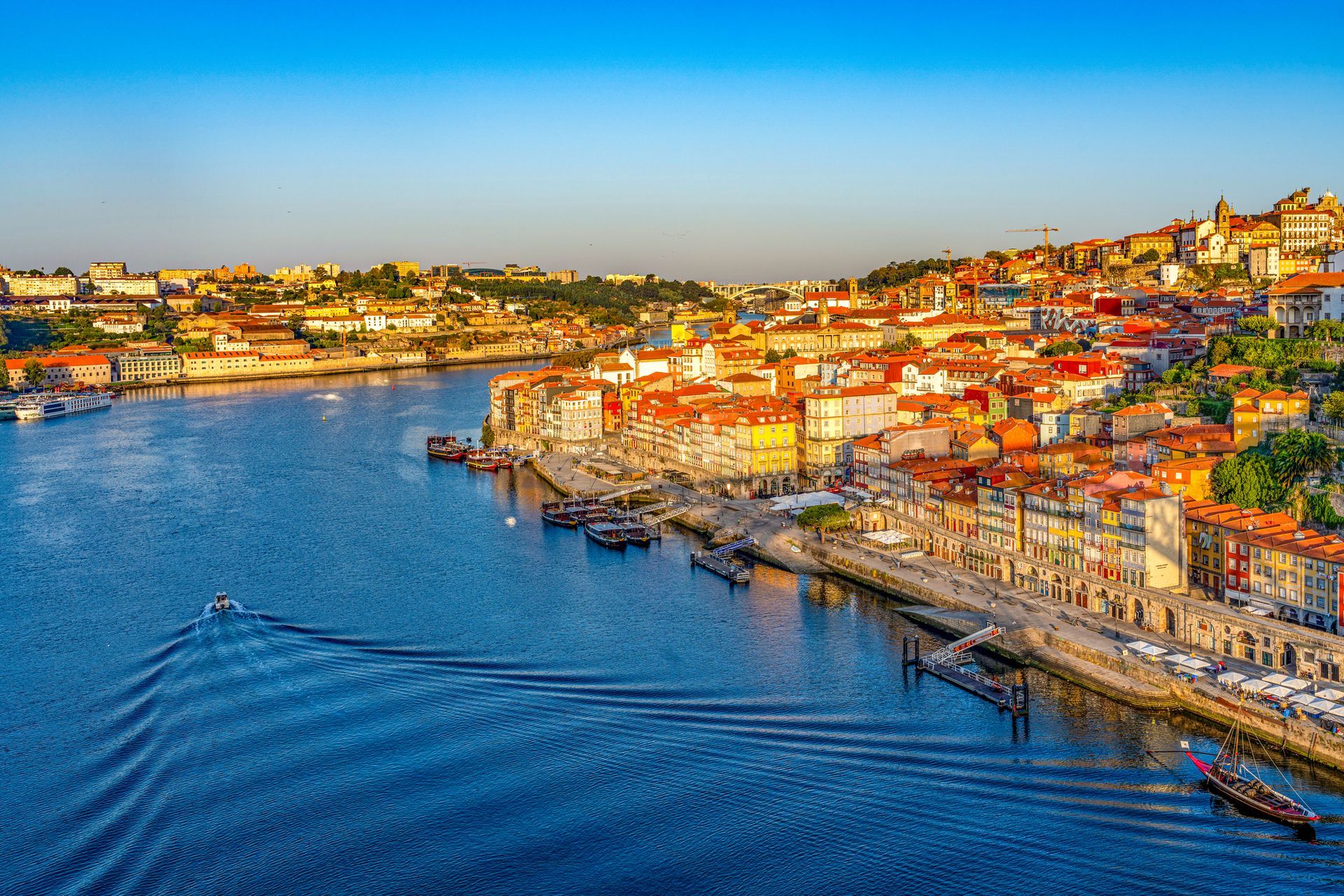 An aerial view of a city next to a body of water.