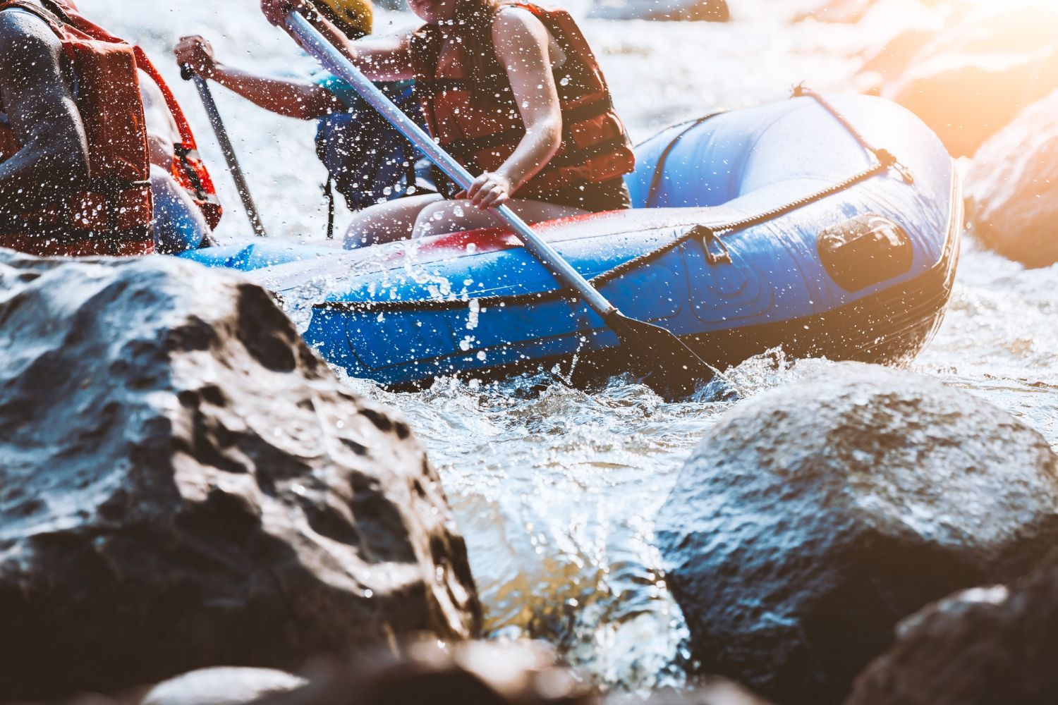 A group of people are rafting down a river.