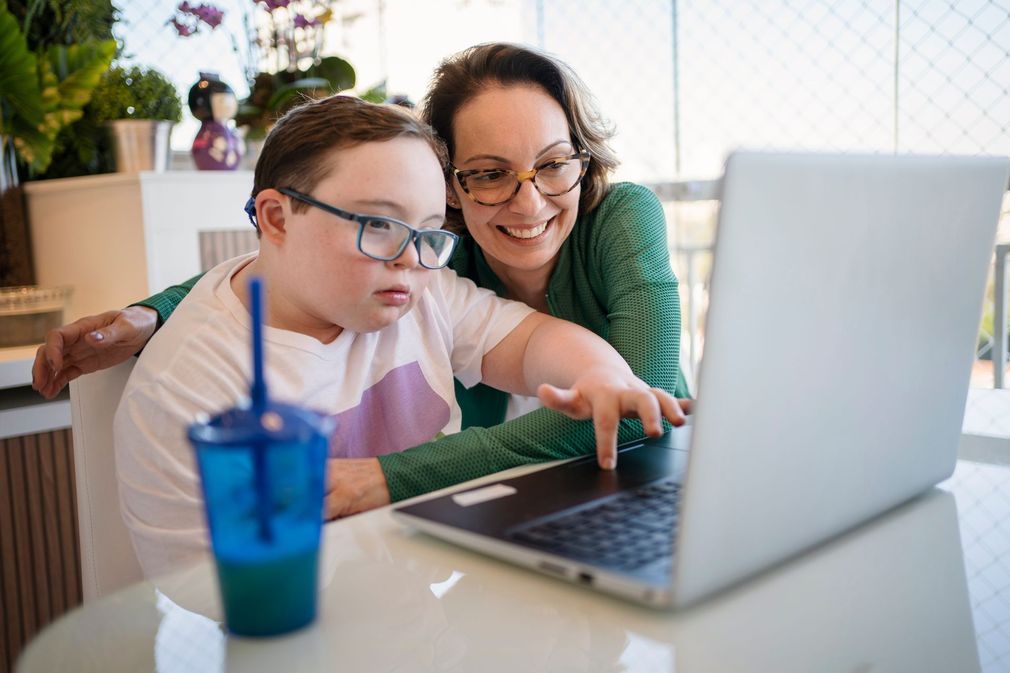 Image of occupational therapist helping child