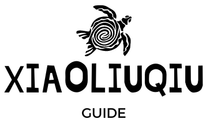 A black and white logo for a guide with a turtle on it.