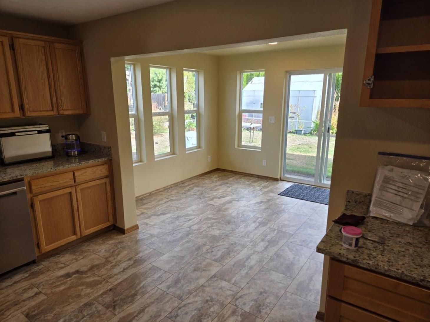 A man is using a circular saw to cut a piece of wood.