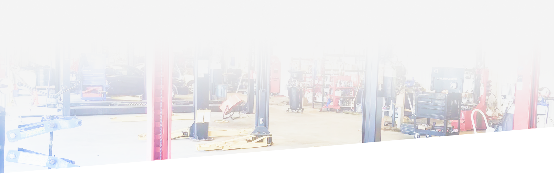 People gathered under a structure with red, blue, and gray support pillars.