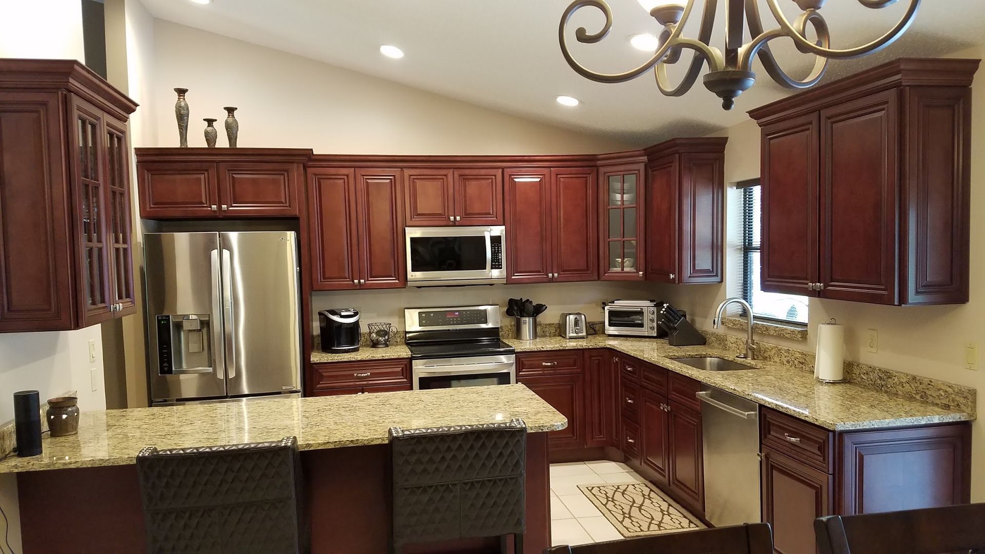 A kitchen with stainless steel appliances and granite counter tops