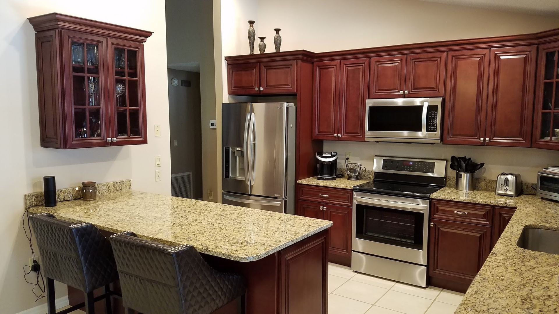 A kitchen with stainless steel appliances and granite counter tops