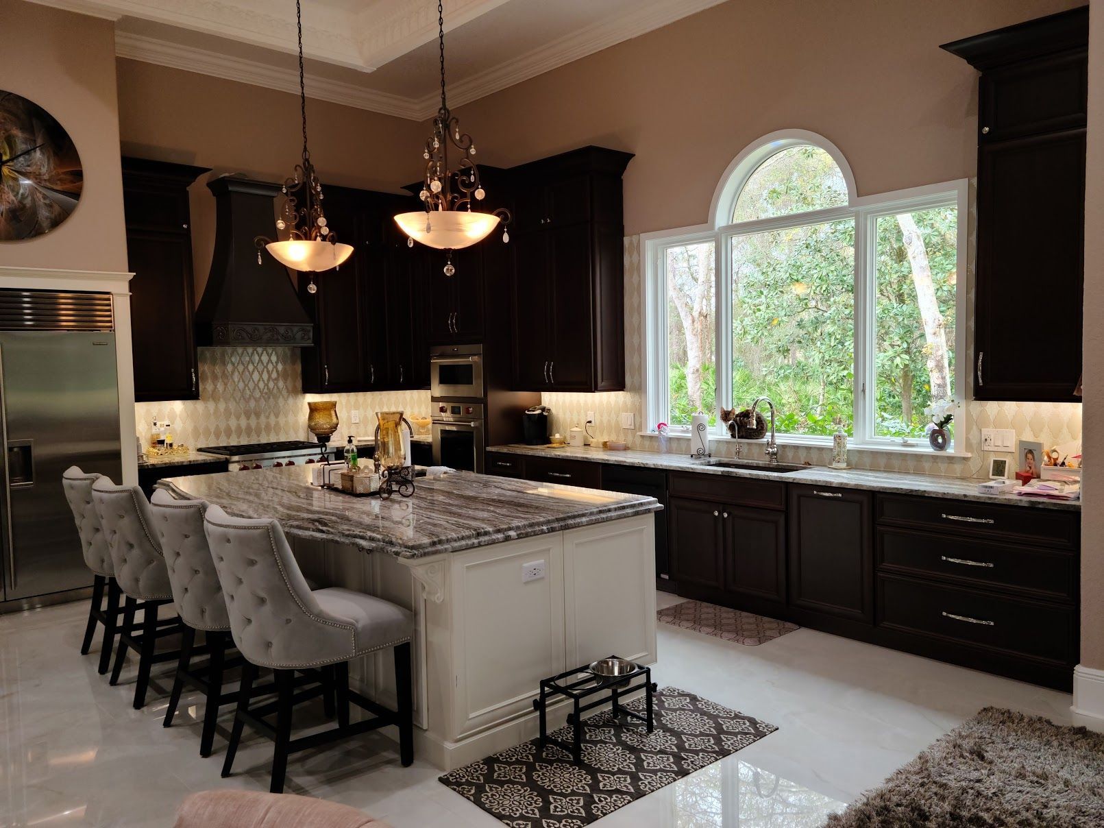 A large kitchen with a large island in the middle of the room.