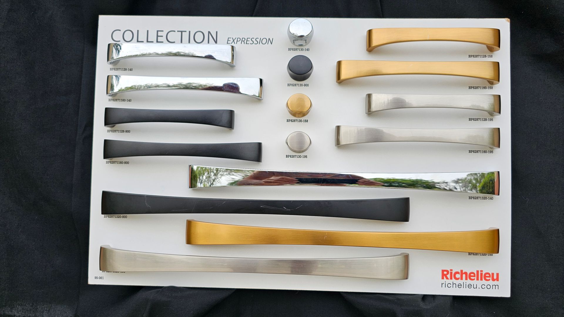 A collection of different colored handles on a white board