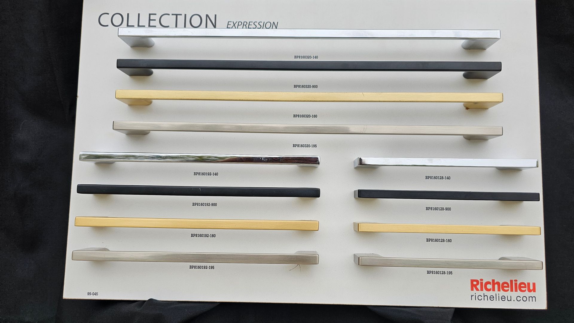 A collection of handles is displayed on a white board