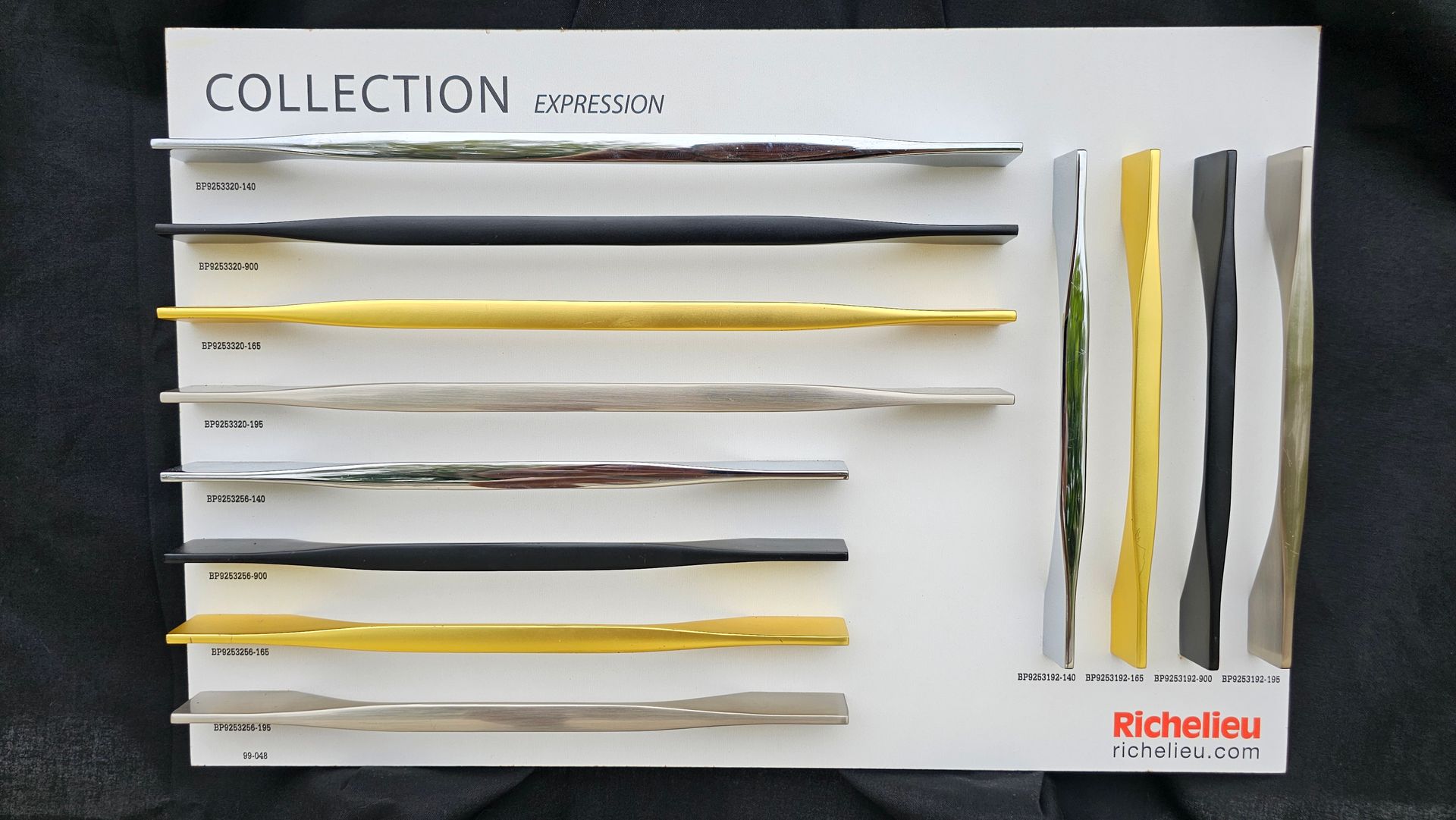 A collection of different colored handles on a white board