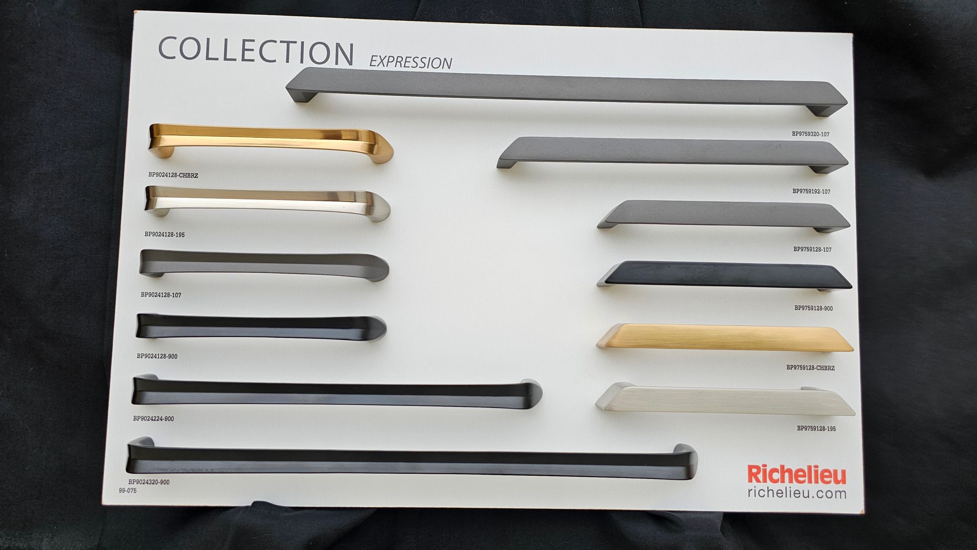 A collection of different colored handles on a white board