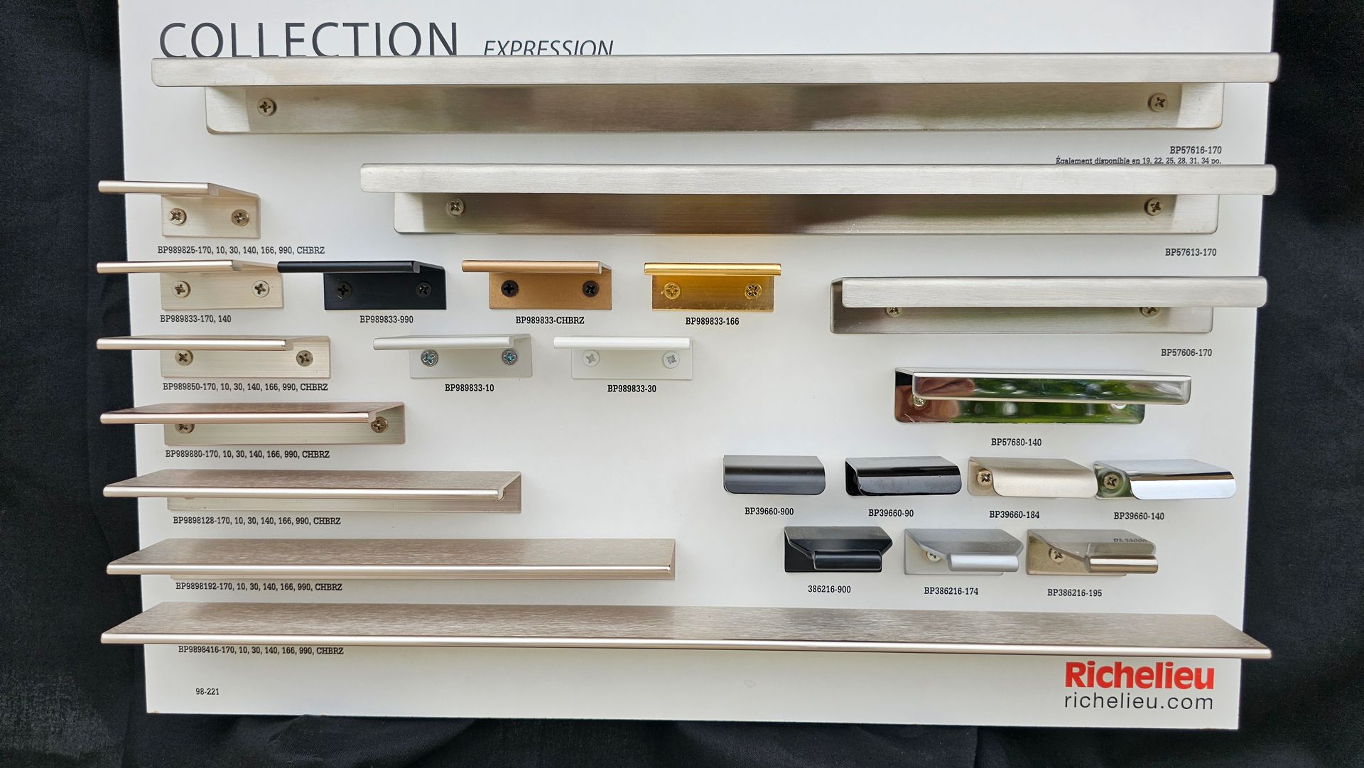 A collection of handles is displayed on a white board