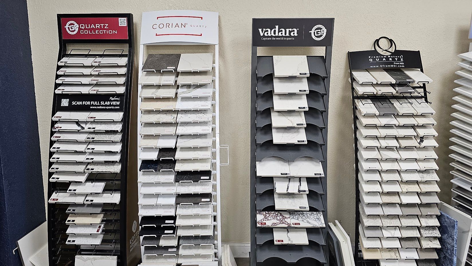 A row of display stands filled with different types of tiles