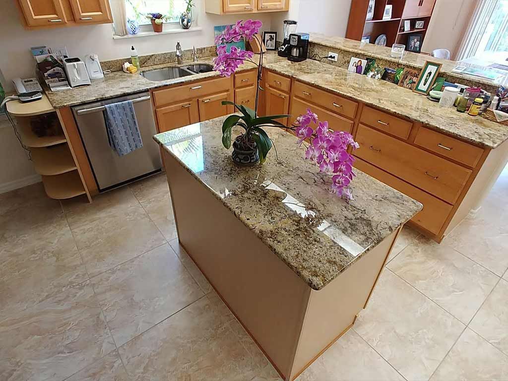 A kitchen with a large island in the middle of it.