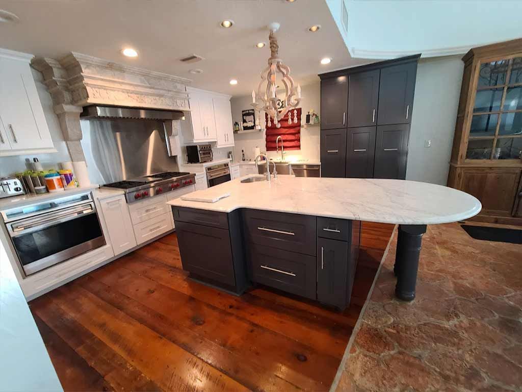 There is a large island in the middle of the kitchen.