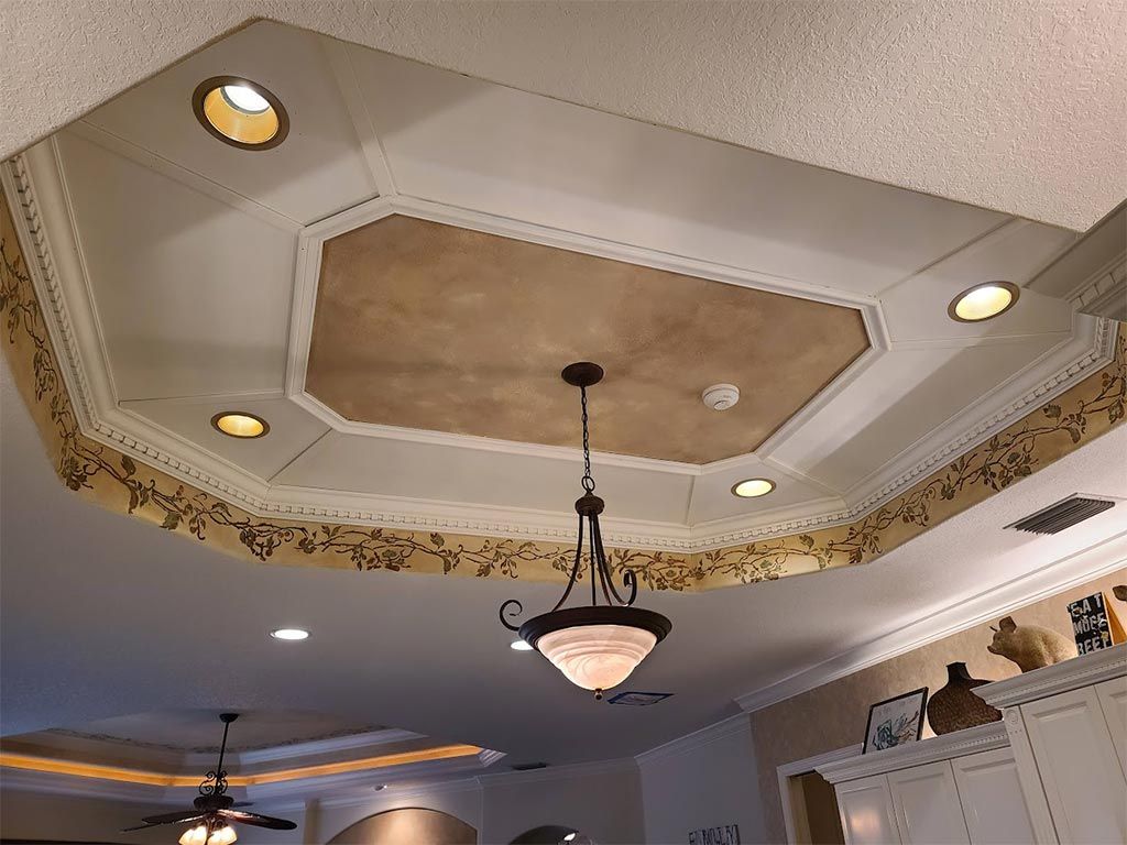 A ceiling with a chandelier hanging from it