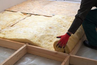 Floors — Worker Laying Insulation On Floor in Oak View, CA