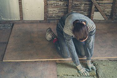 Angeles — Woman Removing Old Floor Insulation in Oak View, CA