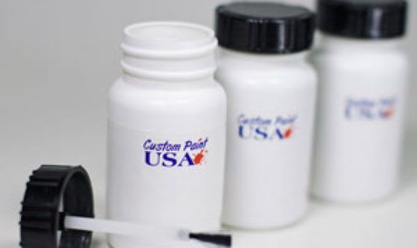 Three white bottles that say custom paint usa on them