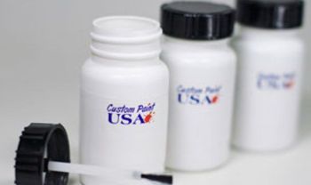 Three white bottles that say custom paint usa on them