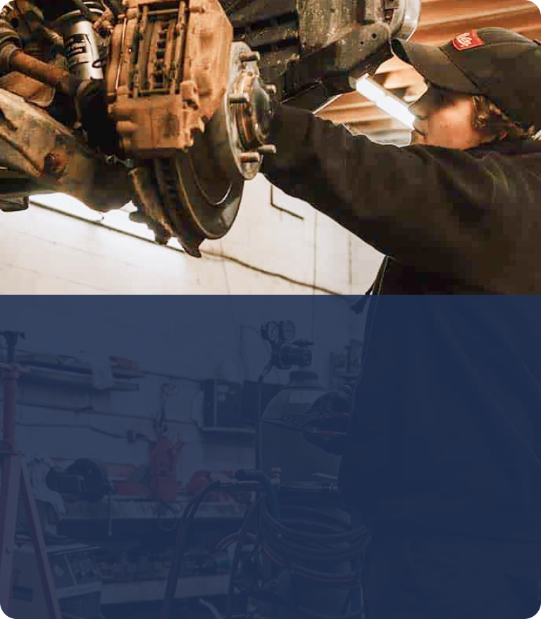 A man is working on a car in a garage. | Silvhorn Automotive