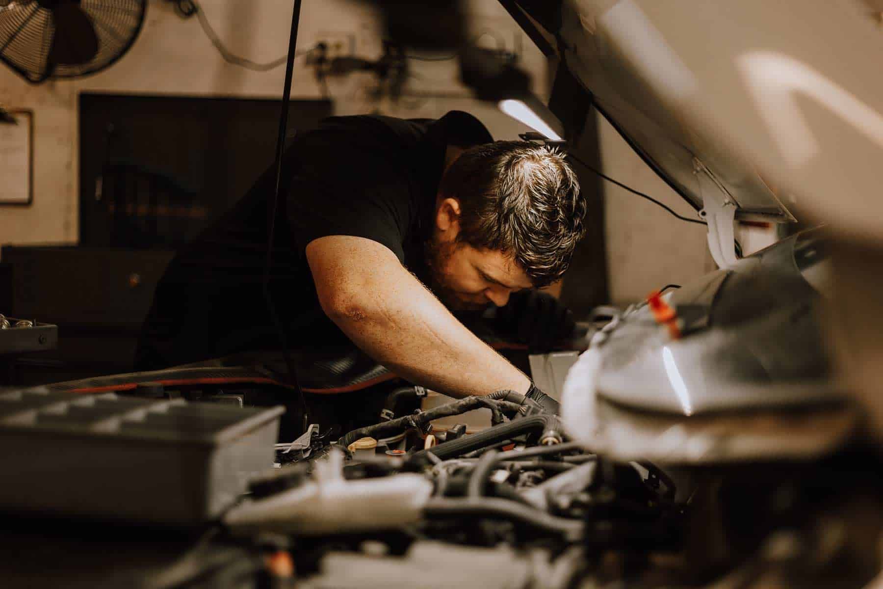 A Pemberton Mechanic Working under the Hood | Silvhorn Automotive