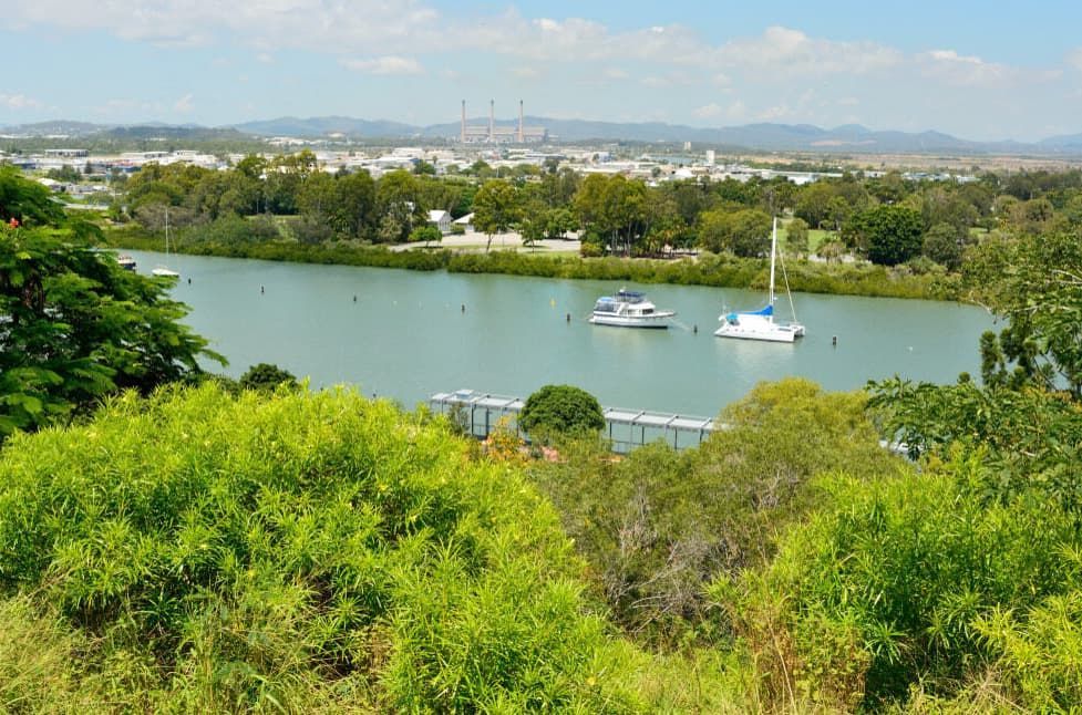 A River With Boats In It And A City In The Background — Capricorn Communications in Gladstone, QLD