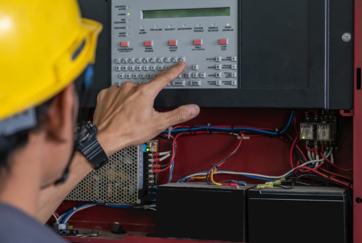 A Man Pressing Emergency System — Capricorn Communications in Kawana, QLD