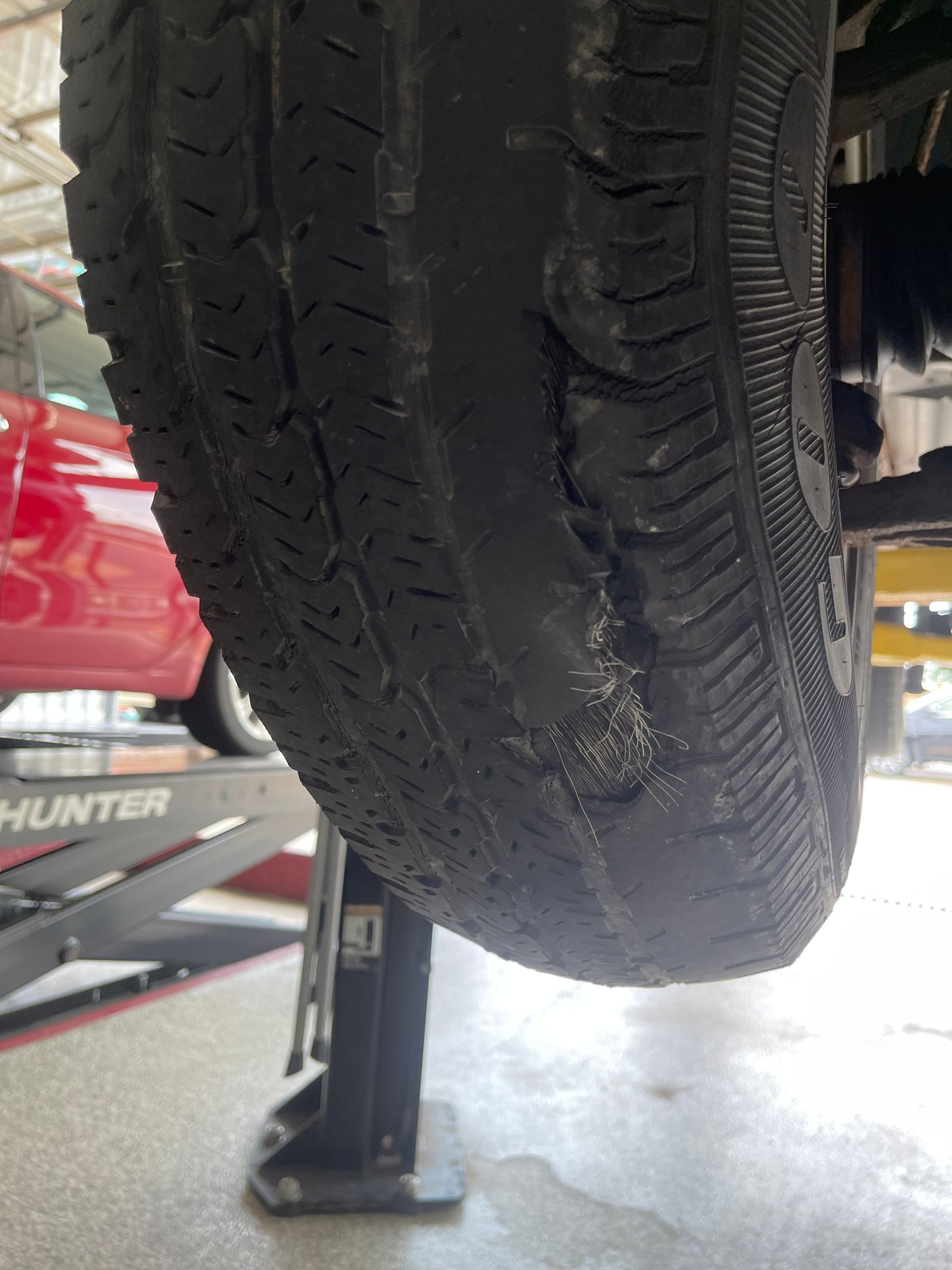 Tire pressure gauge measuring air in a tire.

