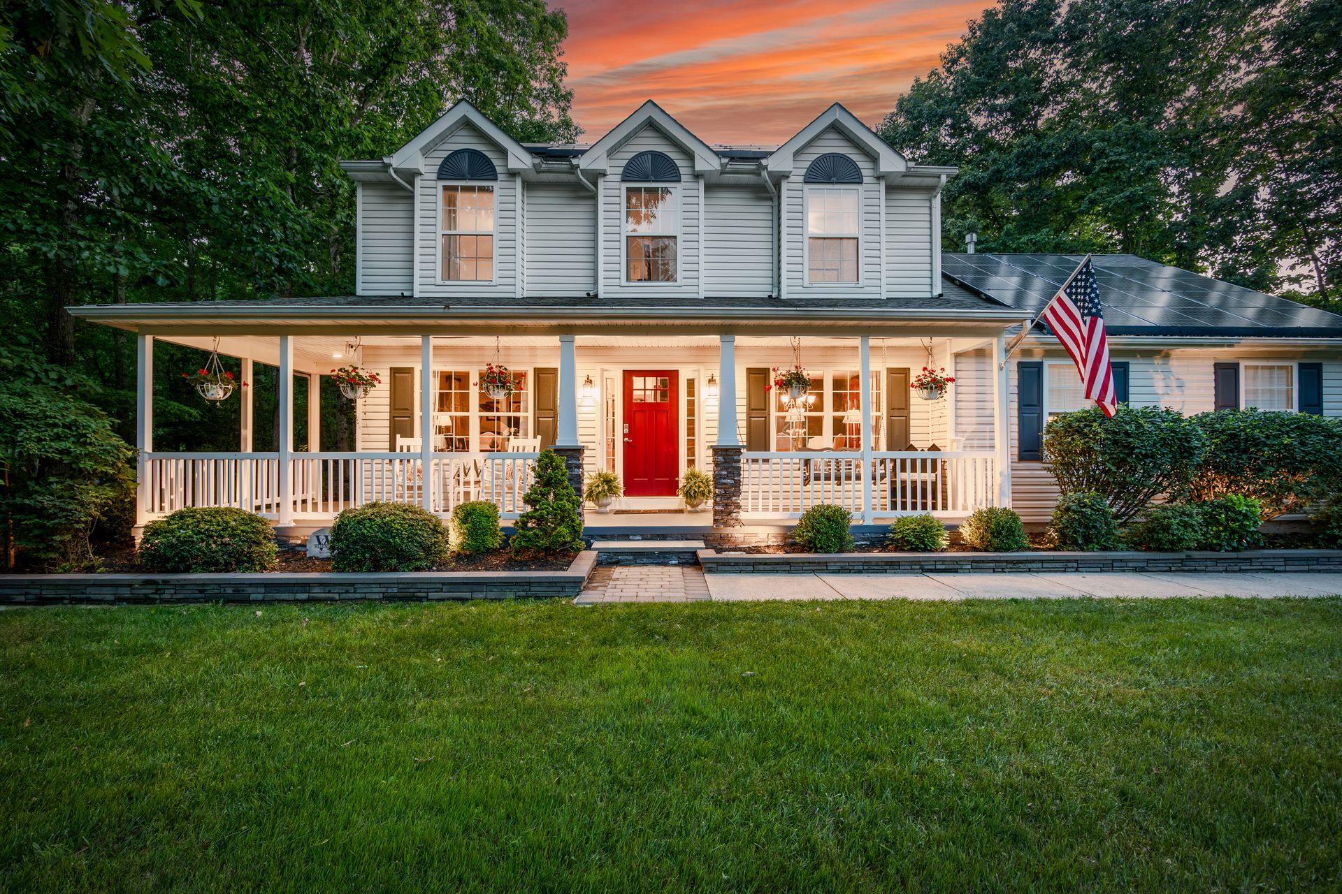 581 Lantern Way at sunset, with the porch lit with warm colors