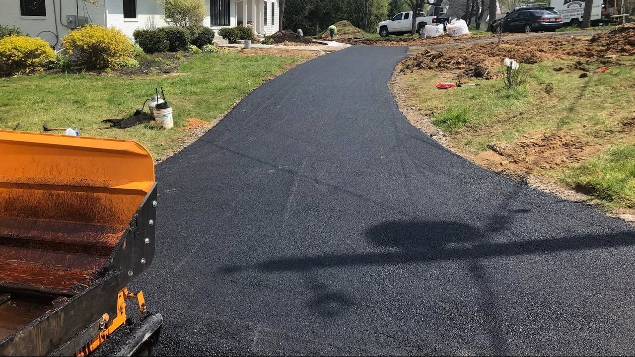 Asphalt driveway being paved by CM Ayres contractors in Maryland