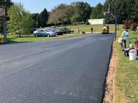 Freshly paved asphalt driveway by CM Ayres Enterprises in Maryland