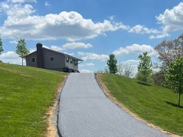 Newly finished asphalt driveway installation in Maryland by CM Ayres