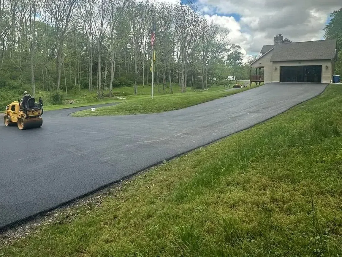 CM Ayres crew resurfacing an asphalt driveway in Maryland