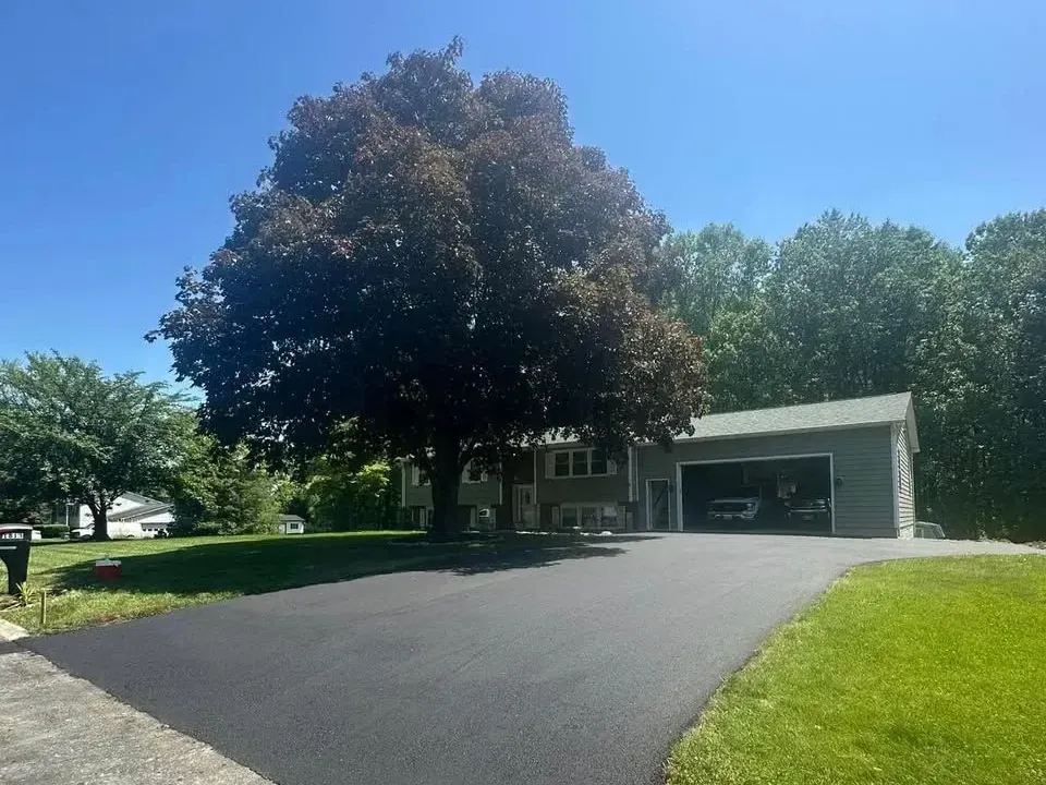 Driveway resurfacing with new asphalt layer in Maryland by local paving contractor